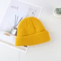 Yellow knitted beanie hat with cuffed design, warm and stylish winter accessory for daily wear. - One Size / Turmeric