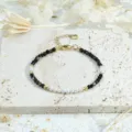 Delicate beaded bracelet featuring dark faceted stones and white faux pearls with gold accents. - Black Agate Bracelet (SET0457-D-BR)
