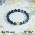Faceted blue vein stone beaded bracelet with golden metal accents for women daily elegant wear. - Blue Sodalite