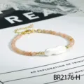 Prachtige Franse stijl onregelmatige parelarmband met gouden accenten en roze edelstenen. - Zonnesteen (BR2176-H)