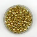Close-up view of shiny gold round beads, perfect for DIY jewelry making and spacer design. - 16000 Pieces/Pack / Gold