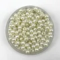 Close-up detail of smooth white ABS plastic imitation pearls, perfect for DIY jewelry and crafts. - 4mm / Off White