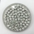 Close-up detail of white acrylic pumpkin beads with silver lines, perfect for DIY jewelry making. - 8mm / White