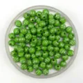 Detail shot of green acrylic pumpkin beads with silver stripes for DIY jewelry making. - 8mm / Grass Green