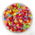Colorful flat round spacer beads close up, perfect for DIY phone case crafts and jewelry making. - 6*1.3mm / Multicolor