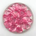 Detailed close-up of translucent pink heart-shaped acrylic beads with horizontal hole design for DIY crafts. - Transparent Pink