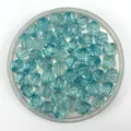 Detailed view of light blue acrylic faceted beads, perfect for DIY jewelry making and accessories. - 10mm / Lake Blue