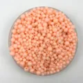 Close-up detail of 4-6mm pastel pink acrylic plastic round beads for DIY jewelry making. - 6mm / Light Orange