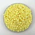 Detailed close-up view of macaron yellow acrylic plastic beads in a transparent tray for DIY. - 4mm / Light Yellow