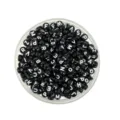 Close-up detail of black acrylic alphabet letter beads, perfect for DIY jewelry making. - 4*7mm / Black and White