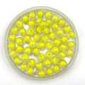 Transparent round DIY craft beads detail shot showing yellow inner spheres inside container - 8mm / Yellow
