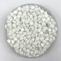 Close-up detail shot of white pearl heart plastic beads for DIY handmade jewelry. - Solid White