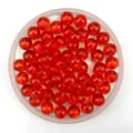 Close-up detail of red transparent acrylic round beads for DIY handmade jewelry crafts. - 6mm / Red