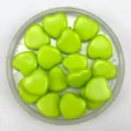 Detailed view of glossy green heart acrylic beads, ideal for DIY jewelry crafting and bracelets. - Solid Green