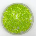 Detailed view of green drilled acrylic ice cube beads, ideal for decorative crafts and displays. - Grass Green