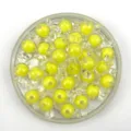 Detailed view of yellow candy-shaped acrylic loose beads for DIY jewelry making and crafts. - 17*9mm / Yellow