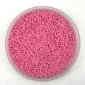 Close-up detail shot of tiny pink non-hole plastic micro beads for crafts and DIY projects. - 2.0mm / Solid Pink