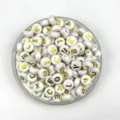 White flat round letter beads with gold stamped alphabet design for DIY jewelry making. - White with Gold Print
