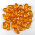 Detailed view of 12x24mm acrylic teardrop pendant beads, vibrant orange diy craft supplies. - Orange Red