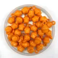 Orange cupcake shaped DIY beads detail shot, showing colorful plastic craft accessories for children. - Orange Red