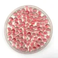 Close-up detail view of pink acrylic core-filled round beads in clear tray for DIY jewelry making. - 8mm / Pink