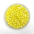 Close-up detail of yellow transparent faceted acrylic beads in tray, perfect for DIY jewelry crafting. - 8mm / Yellow
