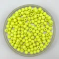 Close up of matte yellow acrylic round beads in container, ideal for DIY handmade crafts. - 6mm / Lemon Yellow