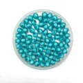 Close-up view of transparent blue acrylic beads arranged neatly for handmade jewelry making. - 8mm / Lake Blue