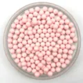 Close-up detail view of solid pink round acrylic beads, perfect for DIY jewelry and crafts. - 6mm / Lotus Pink