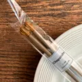 Cactus top alloy chopsticks in clear packaging, ideal for home kitchen and daily dining use. - Latte