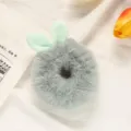 Detailed shot of a cute fluffy grey hair scrunchie with soft light green bunny ears. - Blue Green and Green