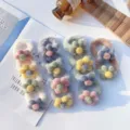 Detail shot of cute plush hair scrunchies with fuzzy floral design, soft autumn winter accessories. - Green Band Green Flower