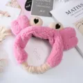 Close-up detail of the cute pink plush crab headband, soft fluffy texture for daily wash face. - Pink