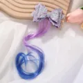 Detailed view of kids glitter bow hair clip with long purple to blue gradient hair extension. - Purple