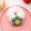 Fluffy white hair scrunchie with cute green plush flower detail, soft winter hair accessory. - White Scrunchie + Green Flower