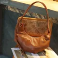 Brown leather hobo shoulder bag detail, vintage dumpling purse with stylish pleated design. - Walnut