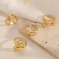 Close-up of stylish gold ring set, featuring unique geometric designs and polished finish. - Style B 4-Piece Set / Gold