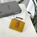 Stylish yellow short women wallet with brown color block design, large capacity and zipper. - Yellow