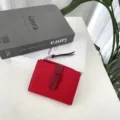 Women red short genuine leather wallet with contrast color buckle and zipper closure daily use. - Red