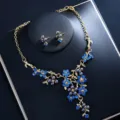 Close-up of blue rhinestone pearl flower necklace earrings set for bridal wedding party. - Blue