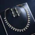 Elegant gold rhinestone necklace and earrings set, perfect for bridal and party jewelry. - Gold Set