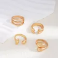 Detail shot of gold-plated metal open rings set, stylish unique design for women daily wear. - Style A 4-Piece Set / Gold