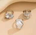 Detailed close-up shot of the three-piece silver irregular metal pearl ring set design. - Style C 3-Piece Set / Silver