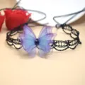 Close-up of the black lace choker featuring a layered purple and blue sheer butterfly pendant. - Black Lace Butterfly Choker