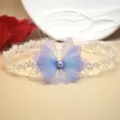 Close-up of white lace choker necklace featuring a gradient purple mesh butterfly detail. - White Lace Butterfly Choker