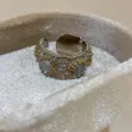Retro silver adjustable daisy ring with grey stone and gold floral details for women variant. - White