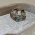 Vintage silver daisy open ring with blue stone and gold stamen, retro style adjustable jewelry. - Blue