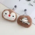 Cute penguin plush brooch detail shot showing embroidered face and back metal clip. - Penguin Brooch with Clip