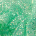 Close-up of green iridescent sequin mesh fabric, perfect for dresses and wedding crafts. - Light Green