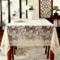 Detailed view of beige rectangular embroidered tablecloth with delicate leaf pattern and lace edge. - 100*150 cm / Light Coffee